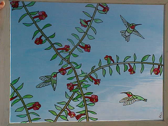 hummingbirds feeding at vine